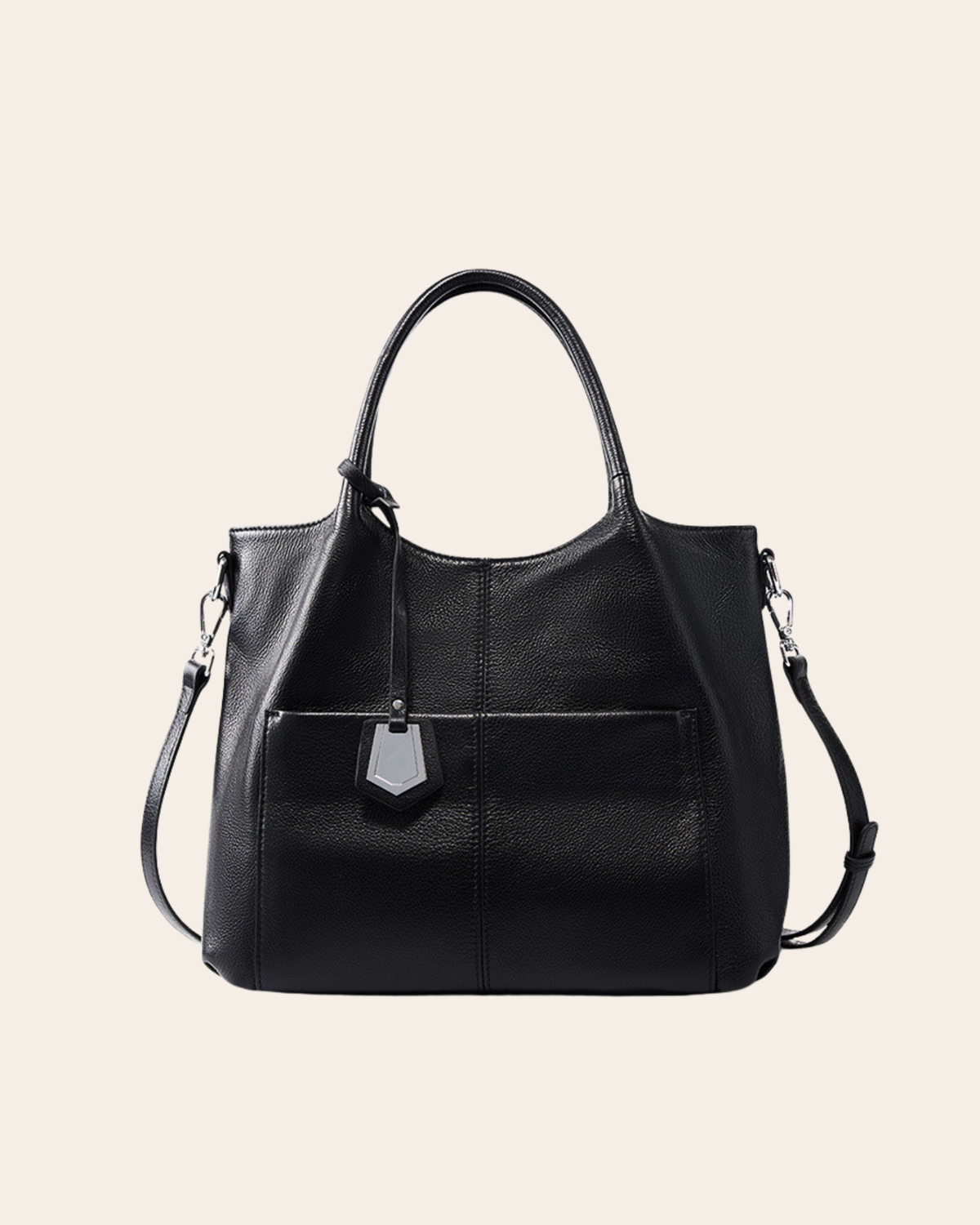 Carry leather tote bag in black, with a zip top, rolled handles and a slip pocket across the front