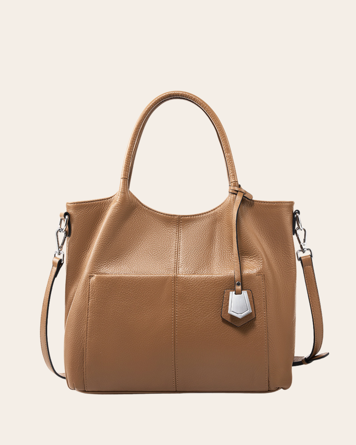 Carry leather tote bag in tan, with a zip top, rolled handles and a slip pocket across the front