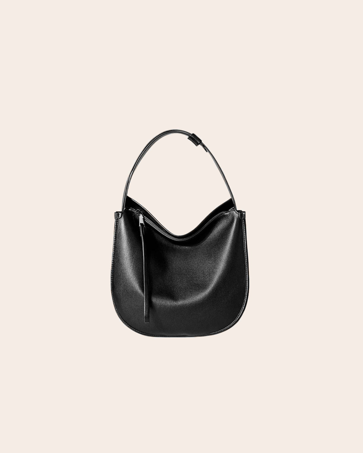 Drift soft leather hobo bag in black, with a curved shape and a zip top