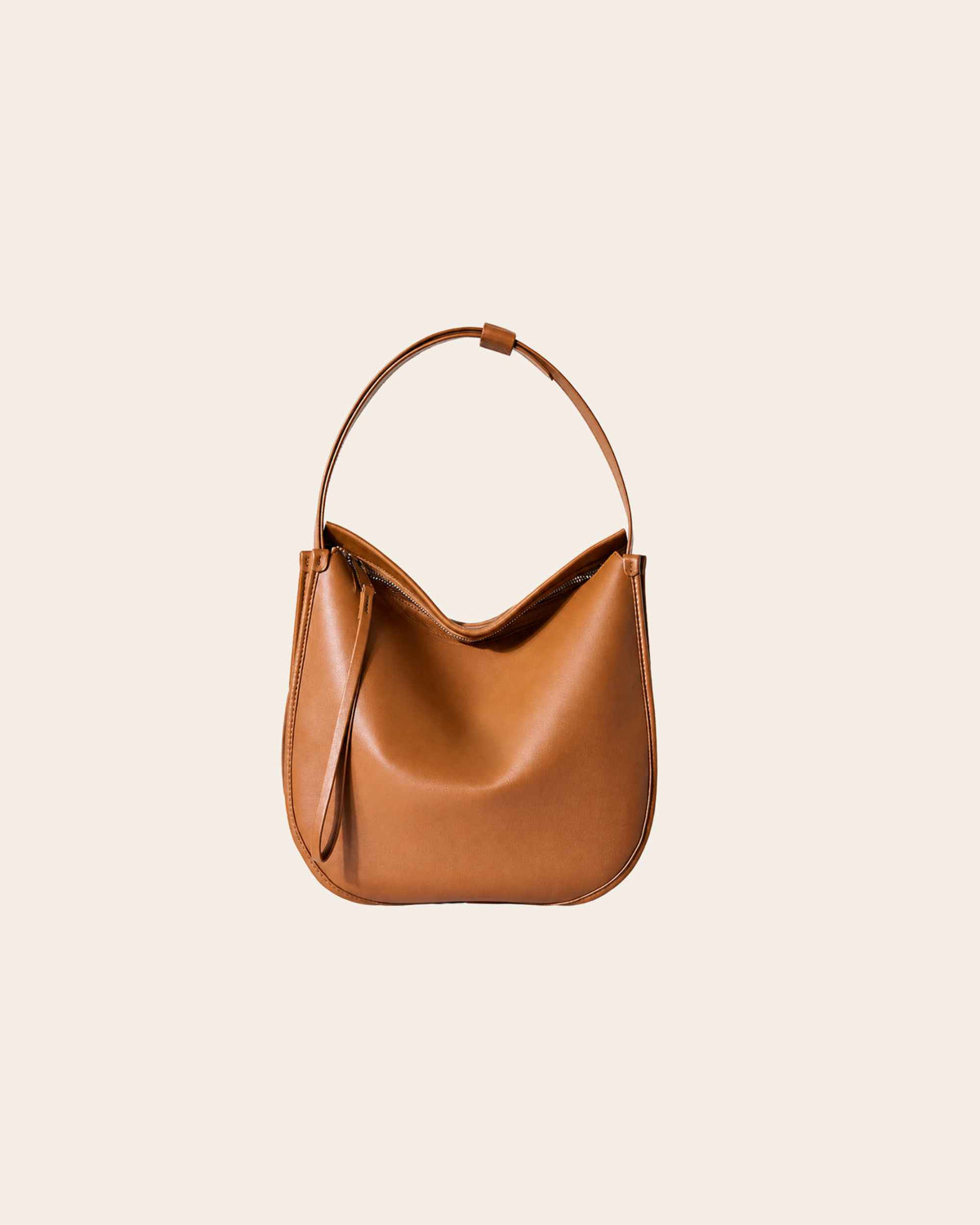 Drift soft leather hobo bag in brown, with a curved shape and a zip top