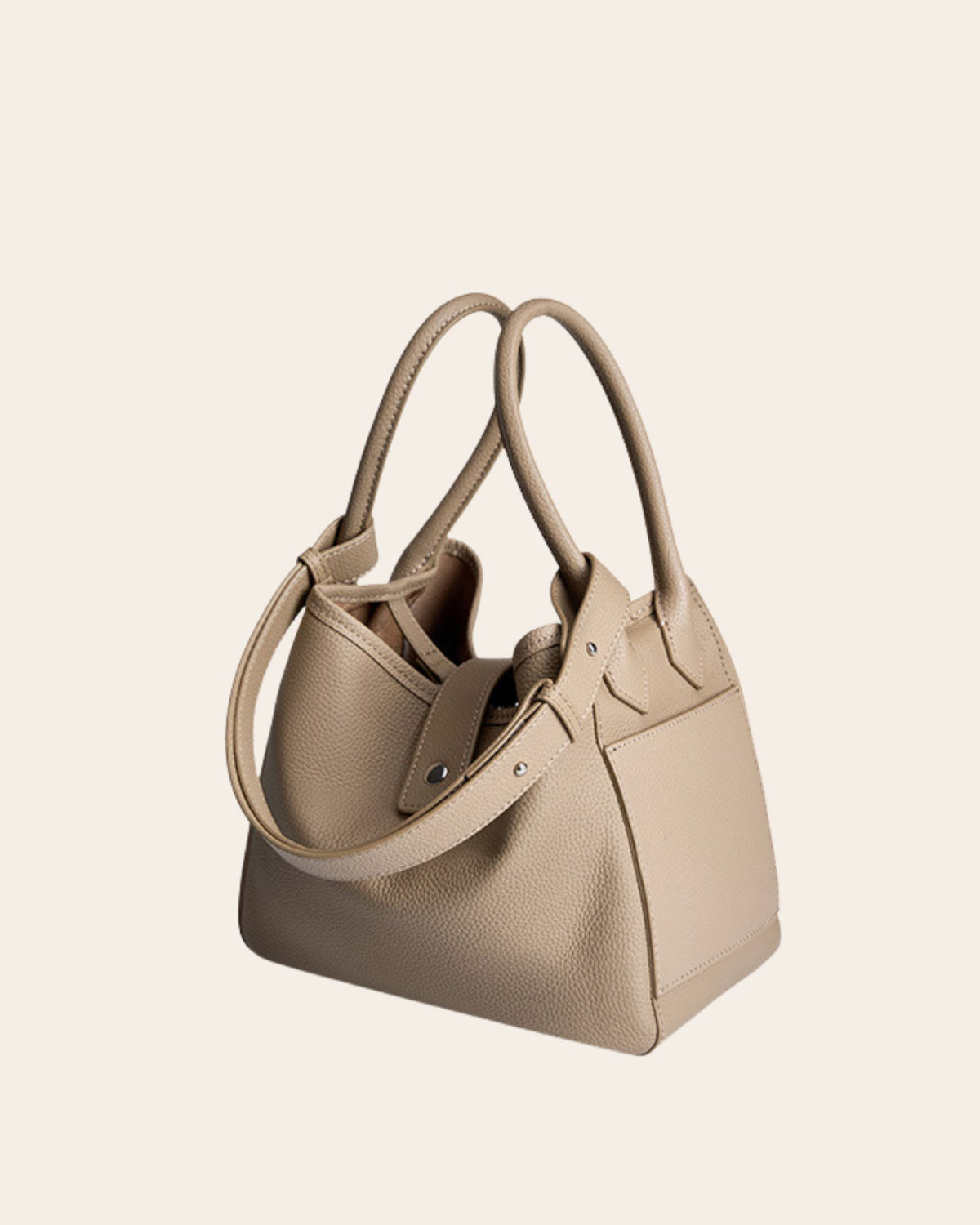 Haven pebbled leather basket bag in elephant grey, with a leather tab closure and a detachable strap