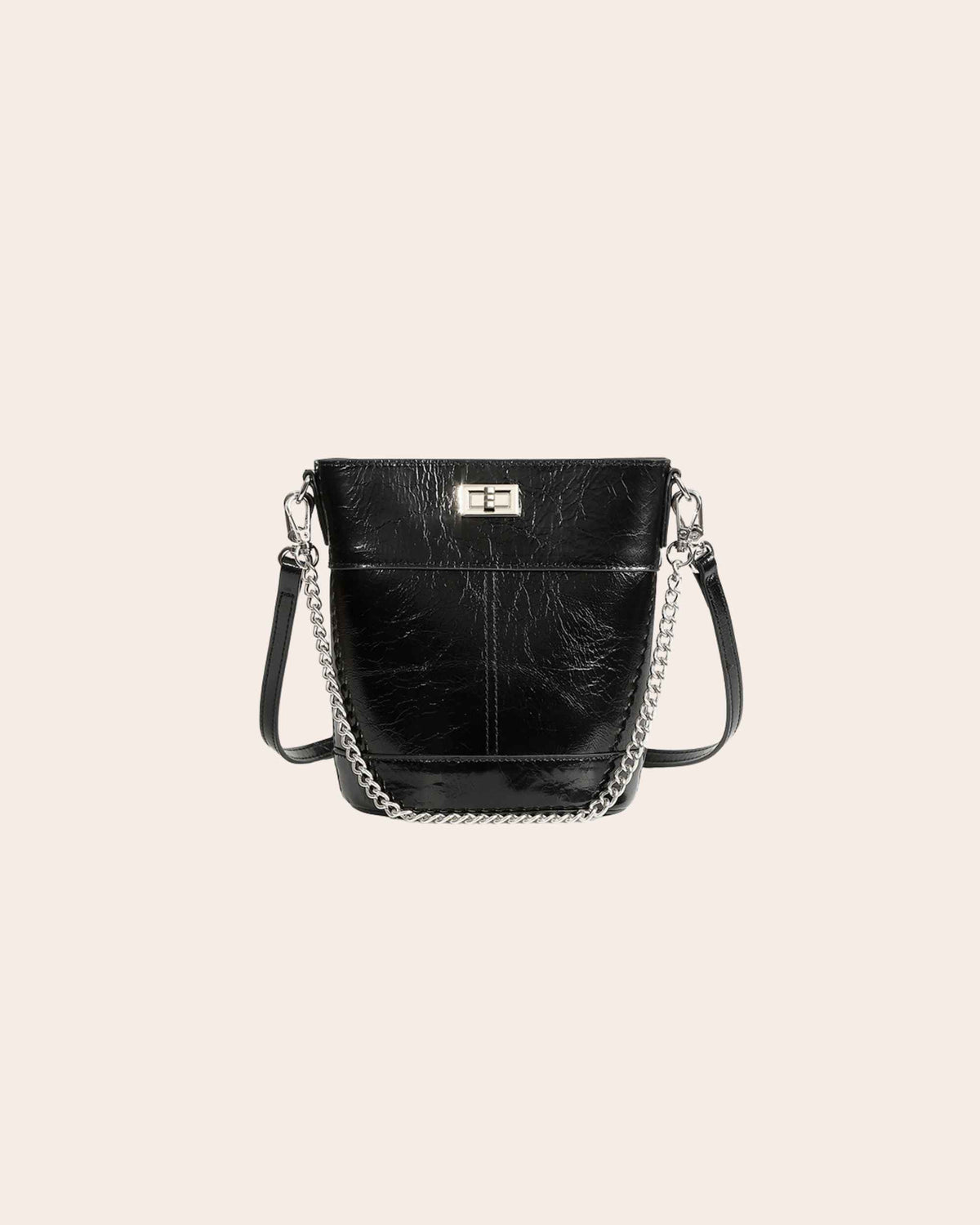 Kindred mini bucket bag in black oil waxed leather, on a chain strap with a turn lock