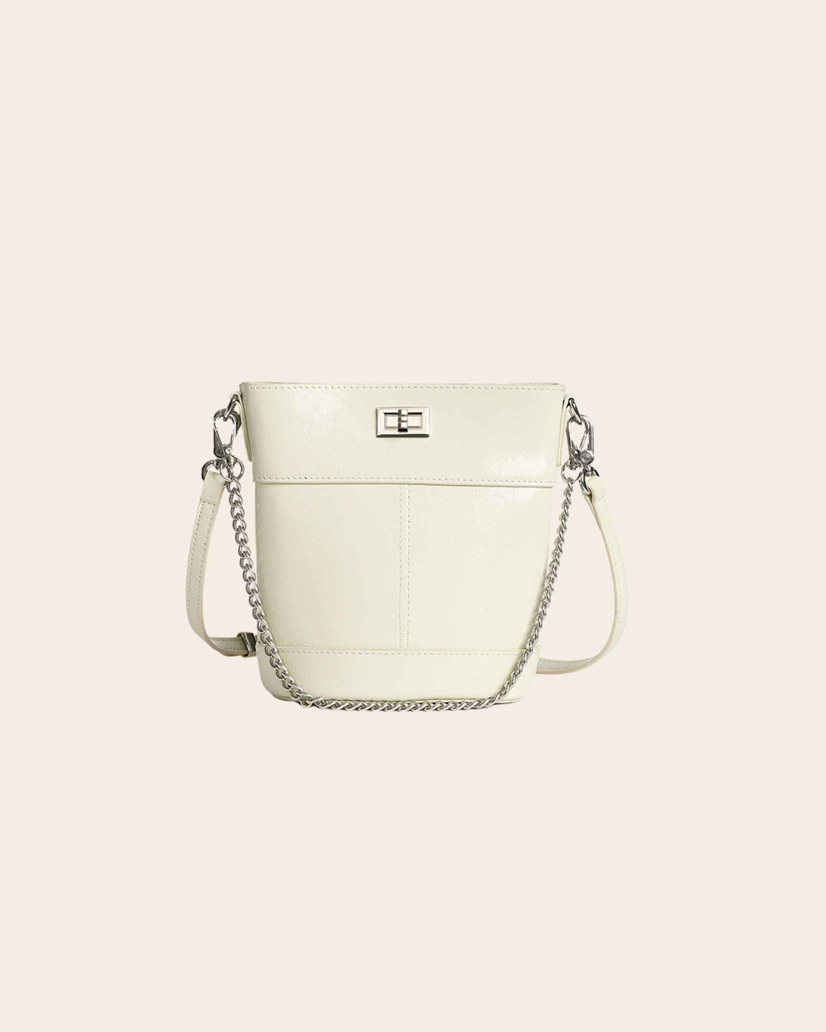 Kindred mini bucket bag in white oil waxed leather, on a chain strap with a turn lock