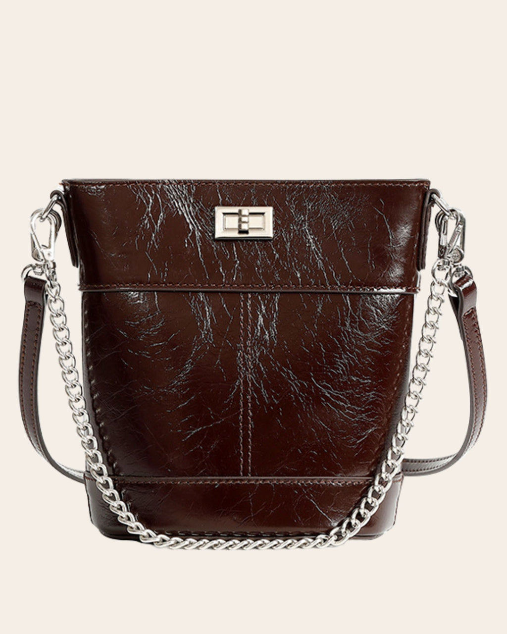 Kindred mini bucket bag in coffee brown oil waxed leather, on a chain strap with a turn lock