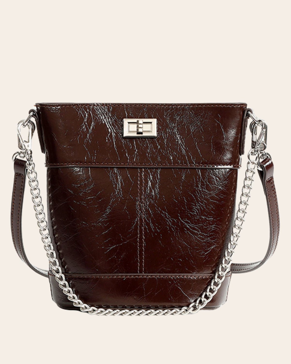 Kindred mini bucket bag in coffee brown oil waxed leather, on a chain strap with a turn lock