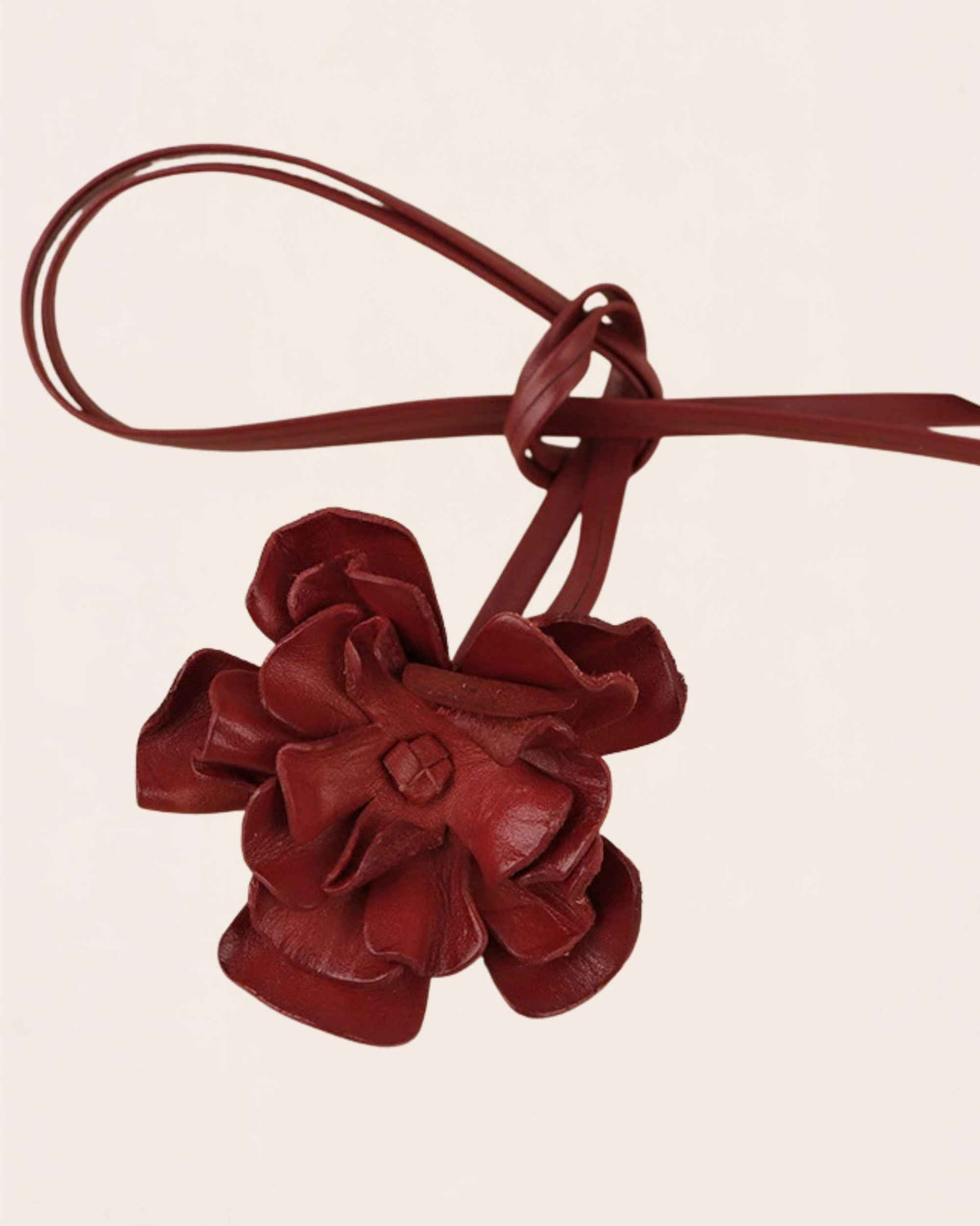 Bloom cowhide flower choker in wine