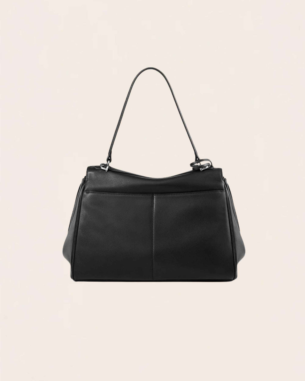 The back of the black leather flap bag, showing the plain rear panel