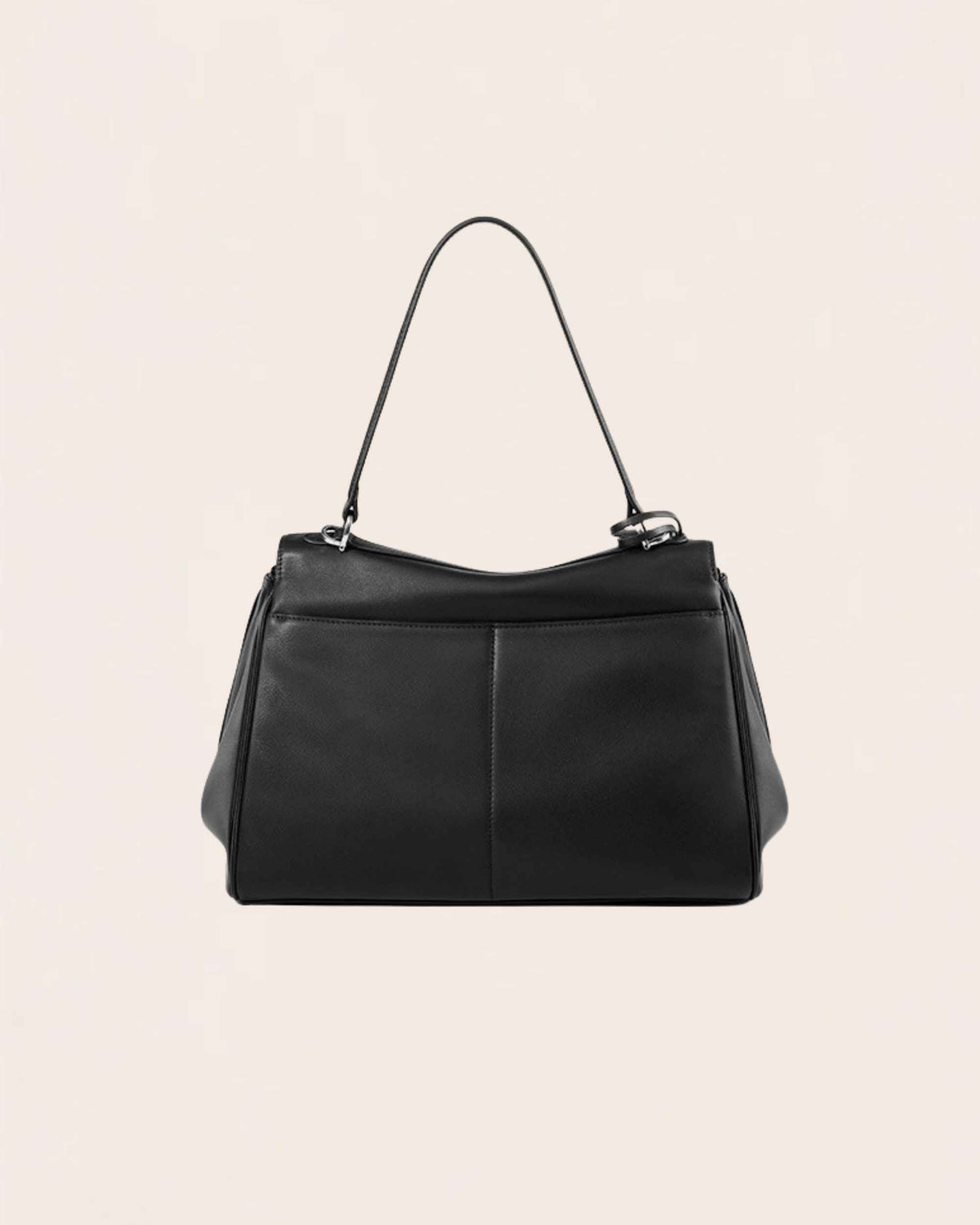 The back of the black leather flap bag, showing the plain rear panel
