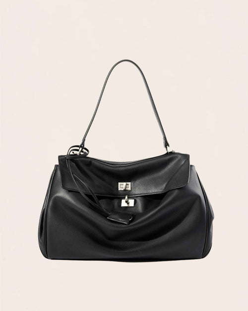 Black soft leather flap bag with a silver turn lock and a top handle, shown from the front