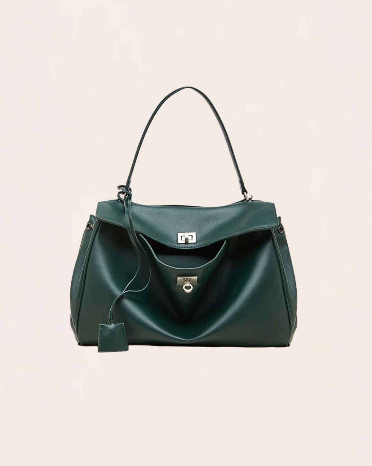 Forest green soft leather flap bag with a silver turn lock and a top handle, shown from the front
