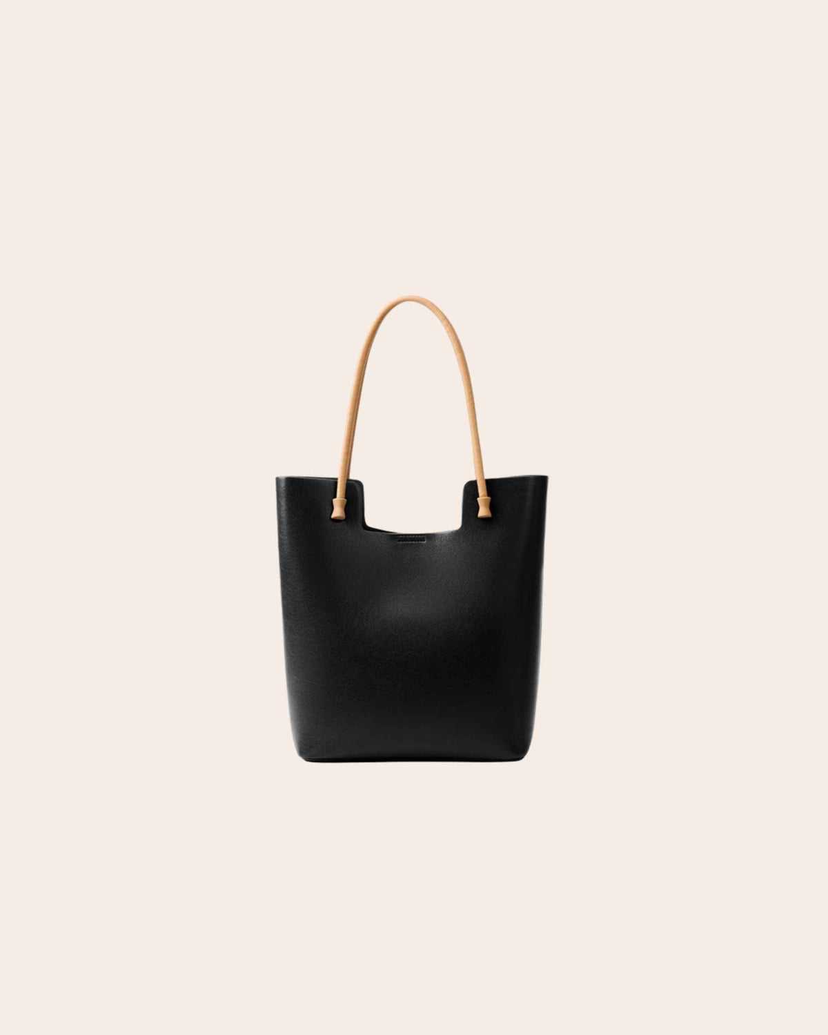 Nest tall leather tote bag in black, with tan leather handles